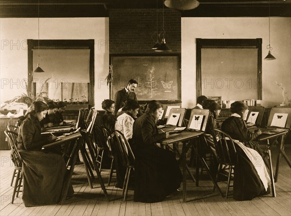 Group portrait of teacher and students at Hampton Institute painting watercolor pictures of butterflies