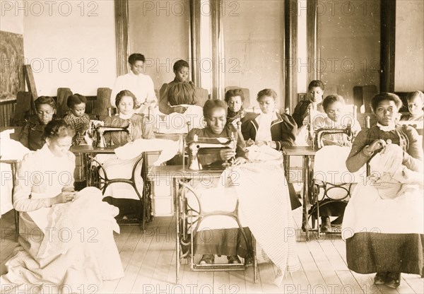 Young women sewing with machines and by hand in the sewing class at the Agricultural and Mechanical College, Greensboro, N.C.