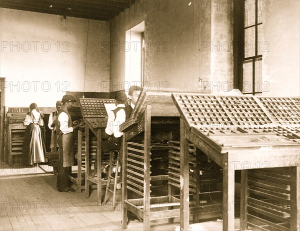 Compositors( Typesetters) at work in printing shop, Hampton Institute