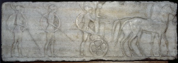 Base of funerary Kouros. Four-horse chariot and hoplites.