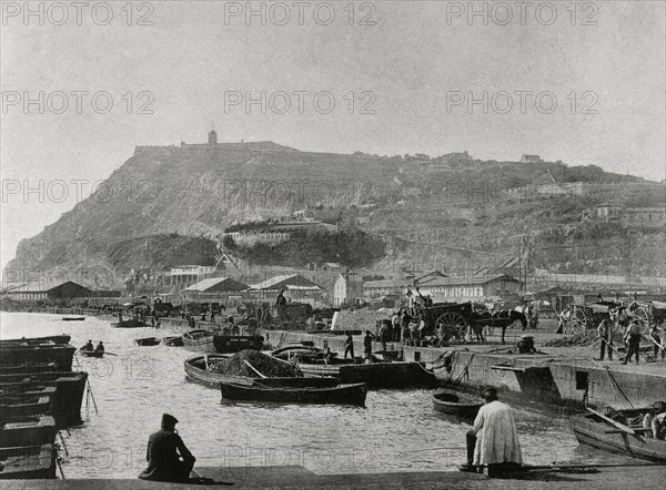 Coal's pier and Montjuic's Mountain in the background.