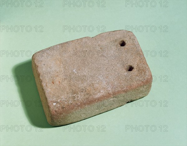 Roman weight for a loom.