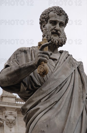 St. Peter holding the key to the gates of heaven.