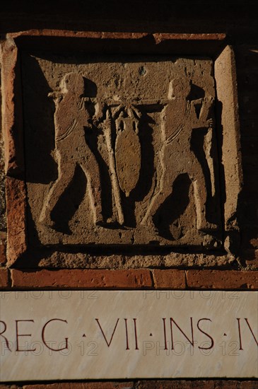 Pompeii. Relief depicting two men carrying an amphora.