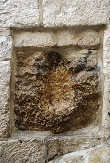 Stone with the print of hand of Jesus.