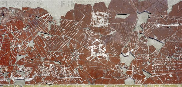 Fragment of a wall facing of a Sanctuary with polychrome paiting and Graffiti.