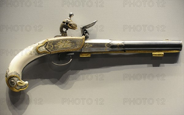 Flintlock pistol.