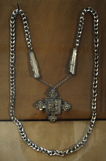Necklace, of beads, crosses, and miniature tools.