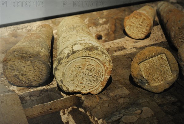 Funeray cones with the name and title of the deceased written in hieroglyphs.