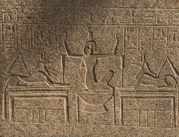 Goddess Nephthys between two figures of god Anubis.