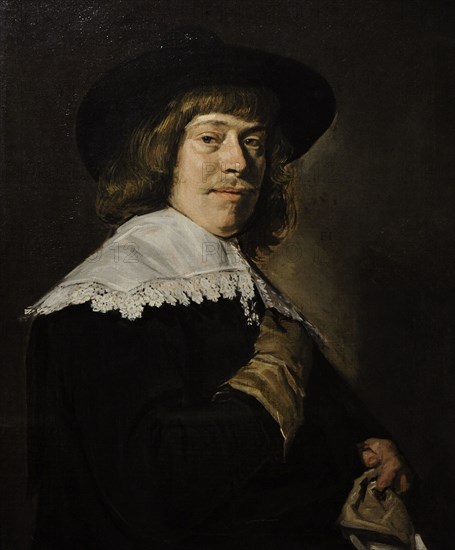 A Young Man Holding a Glove.