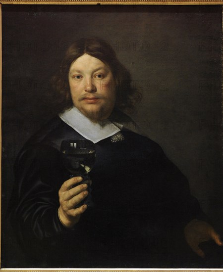 Man Holding a Glass of Wine.