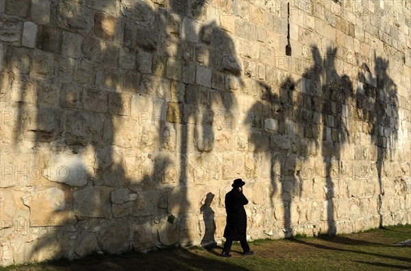 Man walking along the walls.