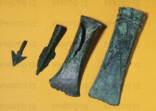 Prehistory. Metal Age. 1st Iron Age. Bronze axes and bronze spear head. From Ripoll, Catalonia.