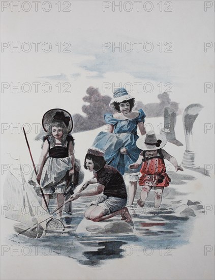 Children play on the beach of the Baltic Sea