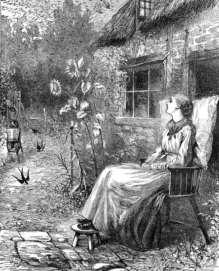 Young woman is sitting in the garden in summer  /  Junge Frau sitzt im Sommer im Garten