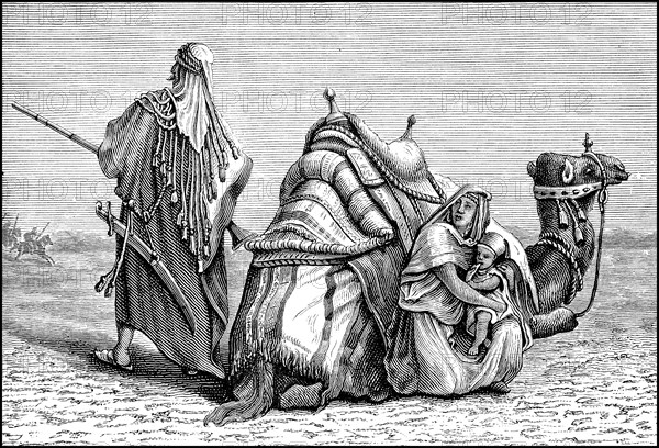 Bedouin family with camel in the Arabian desert