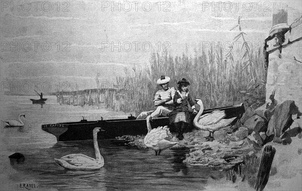 Couple after a trip with rowing boat feeding swans