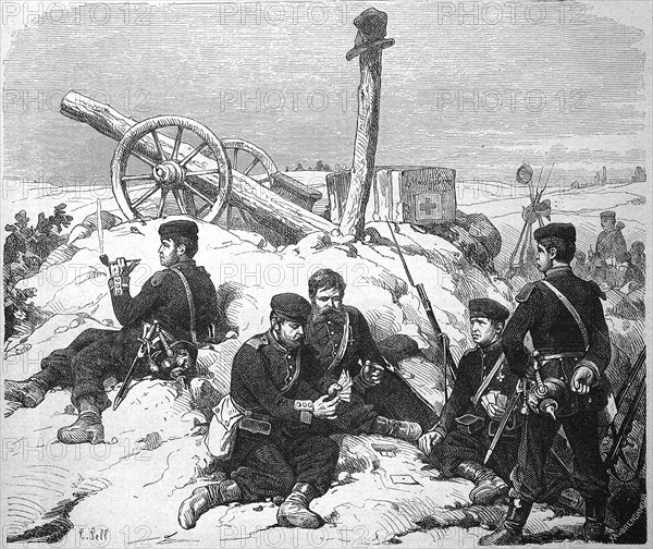 Soldiers in a position infront of Metz during a break in the fighting playing cards