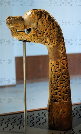 Animal-head post carved in wood