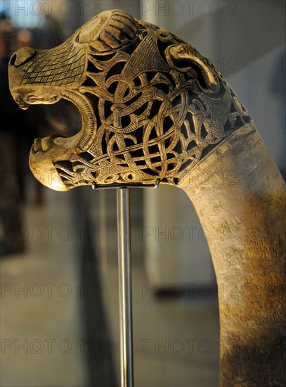 Animal-head post carved in wood