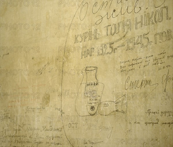 Inscription made by a prisoner on the wall inside a prison cell located in the basement.