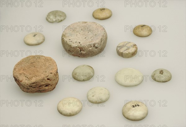 Set of marble and brick of a Roman game.