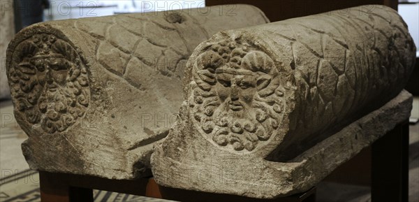 Decorative padded rolls placed on both sides of an altar.