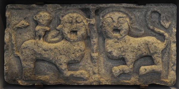 Relief. Pair of lions and a monkey.