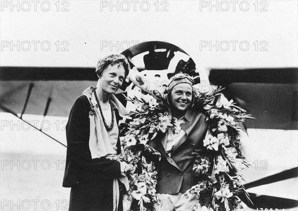 Amelia Earhart (left), woman flier, and Florence Klingensmith, winner of the Amelia Earhart Trophy Race. Cleveland, August, 1932.