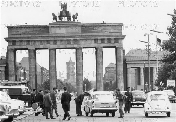 In front of the Brandenberg Gate which marks the border between East and West Berlin, West Berlin police warn motorists about the danger of entering East Berlin. The East Germans have barred West Germans from entering East Berlin, but West Berliners were still traveling freely. West Berlin, August 21, 1960.