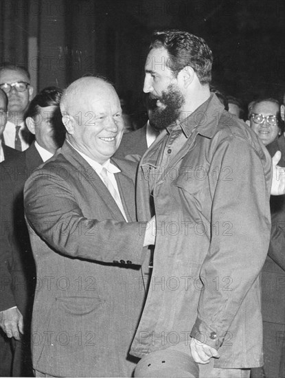 Soviet Premier Nikita Khrushchev (left) gives Cuban Premier Fidel Castro an affectionate pat on the back as the latter arrives for dinner at the Soviet legation. Both were in New York City for the 15th General Assembly of the UN. New York City, 9-23-60.