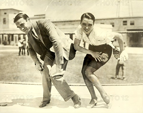 1925 -  Frank Farnum coaching Pauline Starke. And now the Charleston is moving into the movies! Pauline Starke will introduce it to the movie public at large when in the role of a chorus girl in Metro-Goldwyn-Mayer's 'A Little bit of Broadway', she performs it on the screen. Frank Farnum, originator of the step, gave her first-hand (or foot) instructions