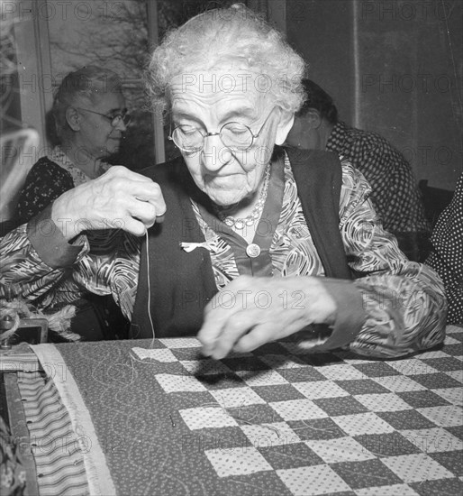 Elderly Woman Quilting