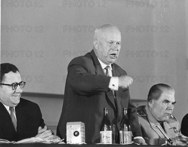 Soviet Premier Nikita Krushchev (center) shakes his fist, as he launches into a bitter tirade at his farewell press conference 5-18-60, after he had attended the Summit conference. At his right is Societ Defense Minister Marshal Rodion Malinovski. Left is Soviet Foreign Minister Andrei Gromyko. Paris, France.
