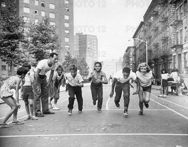 Multi-racial Children Race On City Street