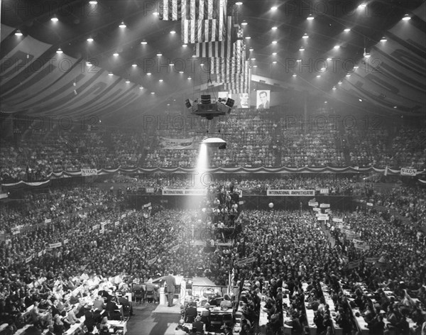 Overall view of the Republican Party's National Convention at the International Amphitheatre in Chicago, Ill in 1960. Hanging in the background are photographs of President Eisenhower, President Abraham Lincoln and Vice-President Richard Nixon.