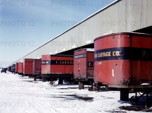 Truck trailers line up at a freight house to load and unload goods from the Chicago and Northwestern [i.e. North Western] railroad, Chicago, Ill. December 1942.