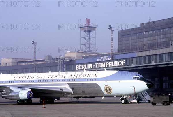 Air Force One, the VC-137C Stratoliner aircraft used to transport the president, sits in a roped-off area near the terminal building at Tempelhof Central Airport during President Reagan's visit to Berlin..