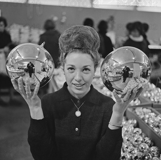 Christmas decorations for sale in department stores. These enormous Christmas balls cost five guilders Date December 19, 1963.