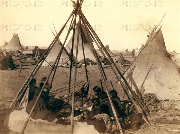 Home of Mrs. American Horse.' Visiting squaws at Mrs. A's home in hostile camp 1891 .