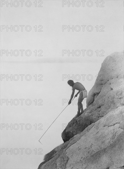 Edward S. Curtis Native American Indians - Fishing with a Gaff-hook--Paviotso Indian circa 1924.