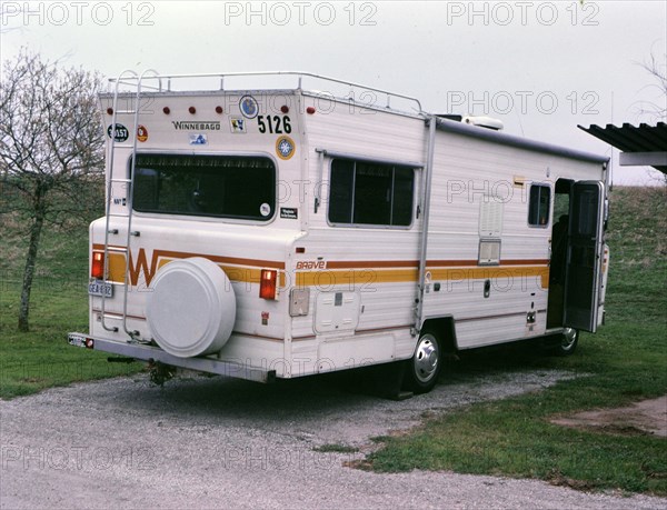 A Winnebago recreational vehicle parked at a campsite circa 1987.