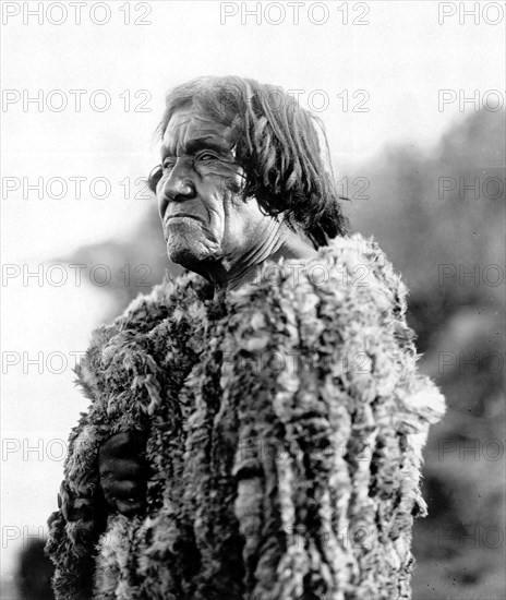 Edward S. Curits Native American Indians - Mohave man, half-length portrait, facing left wearing 'primitive' robe of rabbit skin circa 1907.