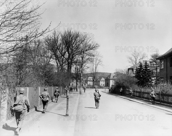 Infantrymen of the 90th Division Walking Through the Captured Town of Hof, Germany circa 4/1945.