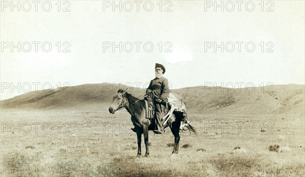 Dick Latham of Iron Mountain, Wyo., returning home from the plains with the antelope he has slain 1888.