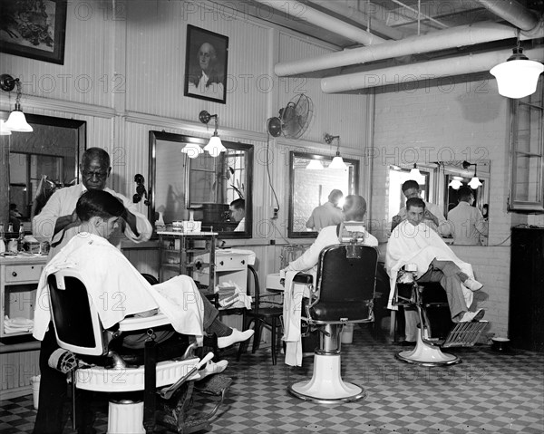 Senators having their hair cut in the Senate Office Building Barber Shop circa 1937.