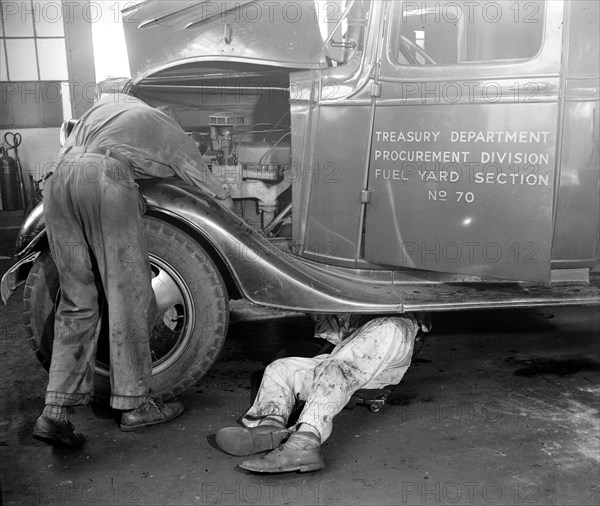 Mechanics Repairing government trucks at the Treasury procurement section circa 1937.