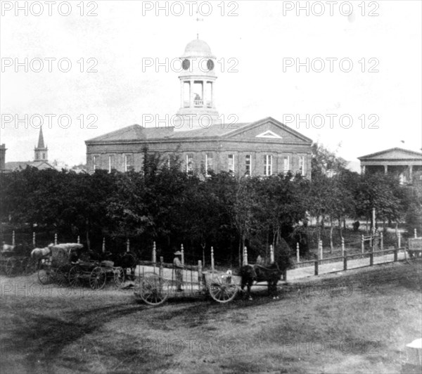 California History - The Court House, Stockton, San Joaquin County - horse drawn wagons in front circa 1866.