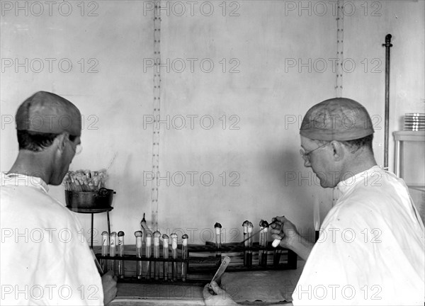 U.S. Army Medical School - Workers in lab with Typhoid Vaccine circa 1917.